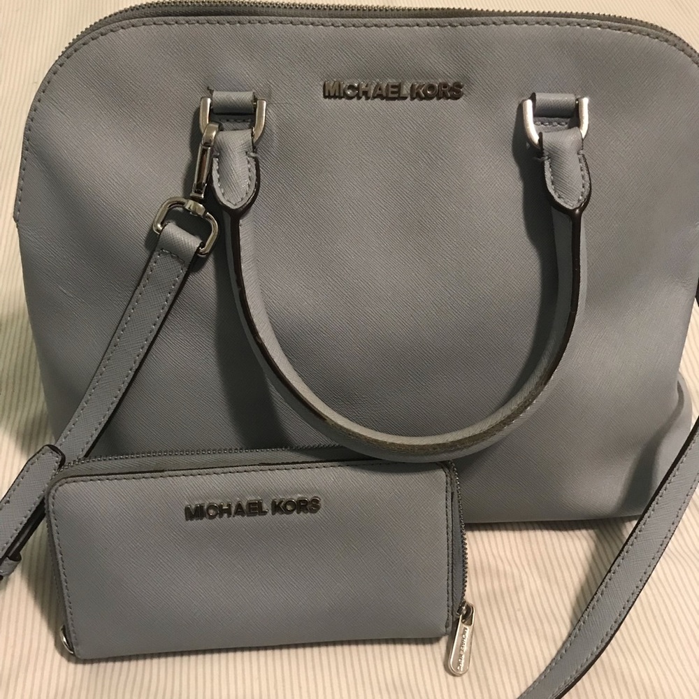 Michael Kors light blue satchel w/ wallet.